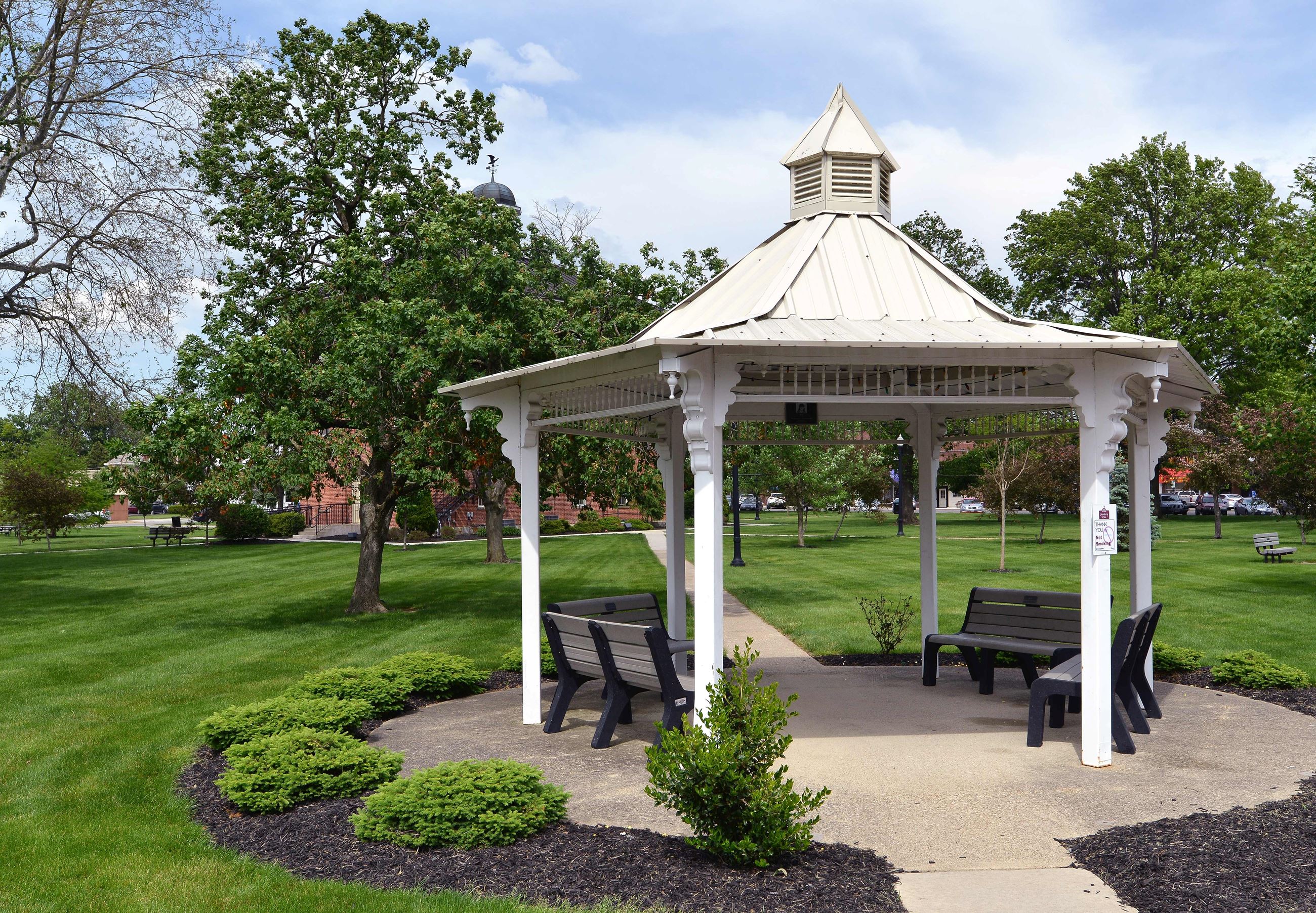 An outside view of town hall grounds and white gazebo